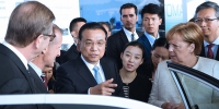 李克强与德国总理默克尔共同出席中德自动驾驶汽车展示活动 - 中国山东网