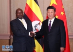 7月26日，国家主席习近平在南非约翰内斯堡会见乌干达总统穆塞韦尼。 新华社记者 廖宇杰 摄 - 中国山东网